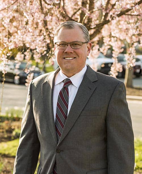 Jud in front of cherry blossom